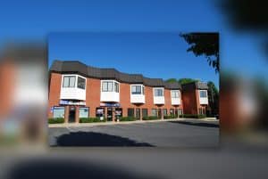 aikens court complex exterior 300x201 1
