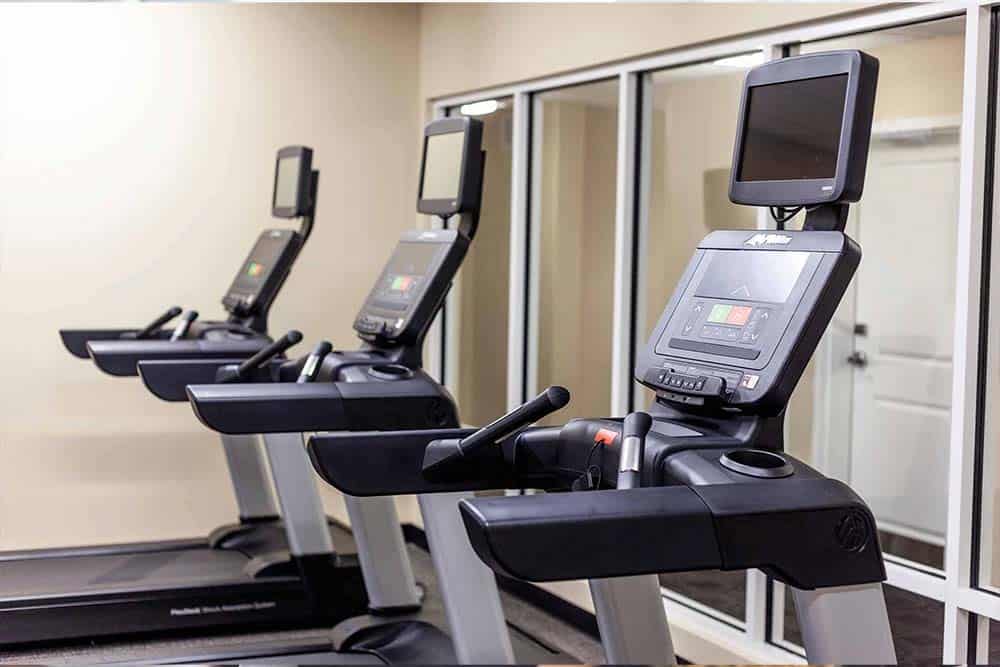 Fitness center at an Aikens Group hotel, available to team members and their families