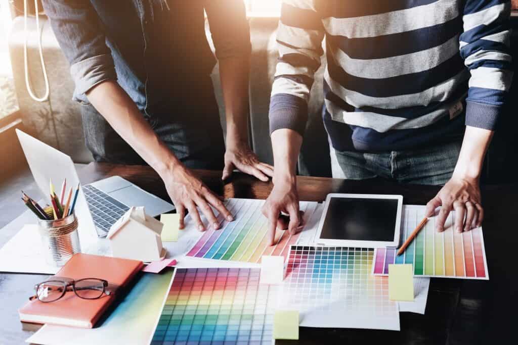 Marketing team reviewing brand colour palettes and design materials
